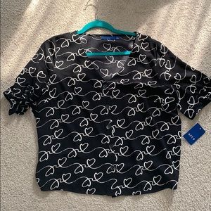 NWT flowy button down shirt with heart detail.
